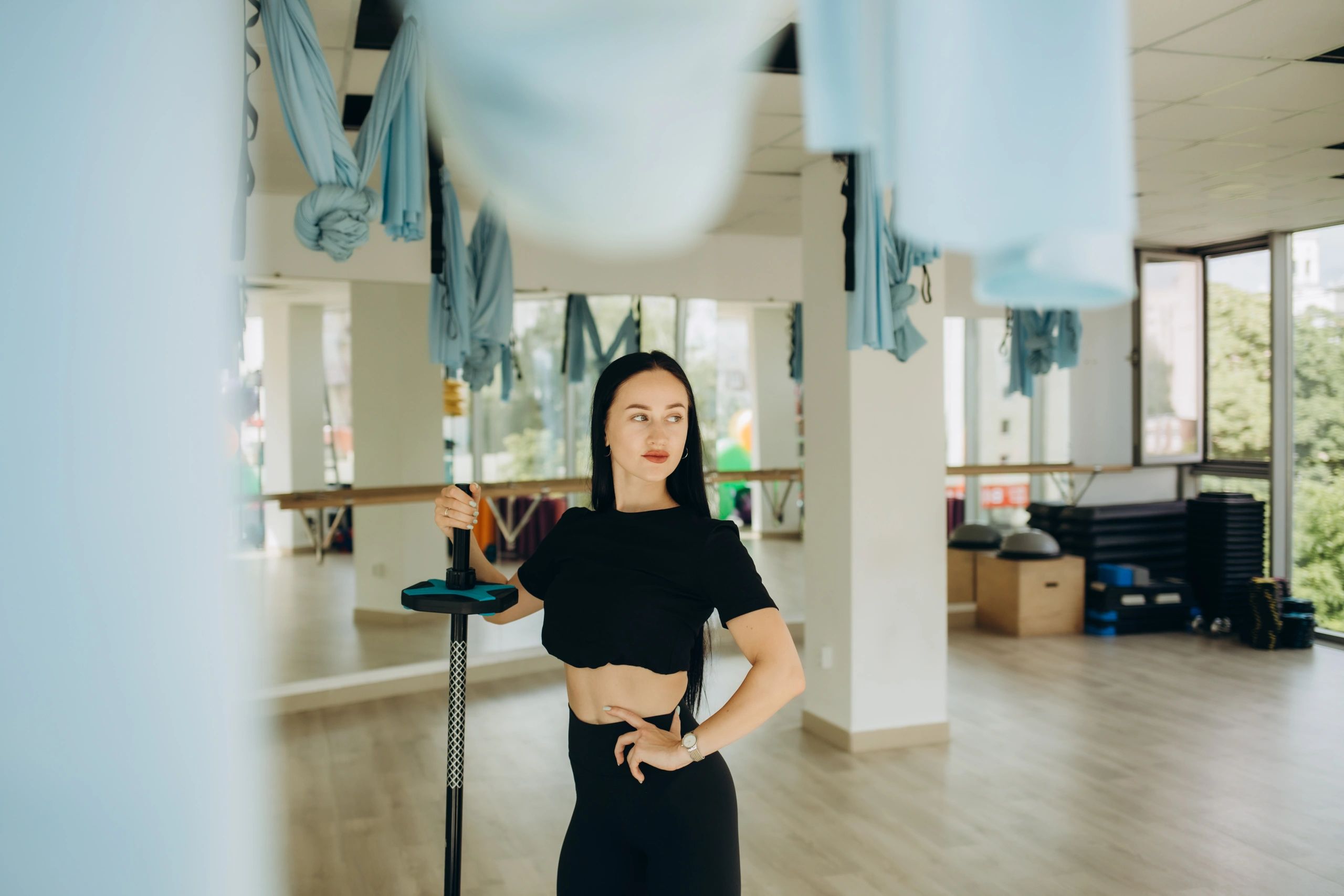 woman pole dance fitness studio